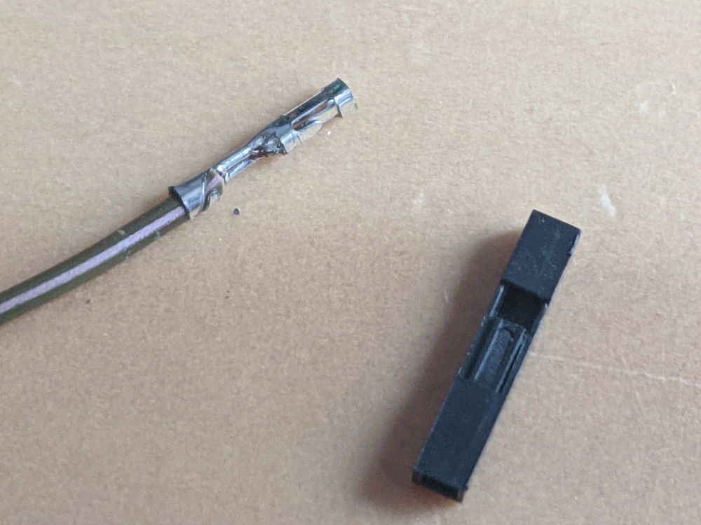 prying the lever on the jumper cable